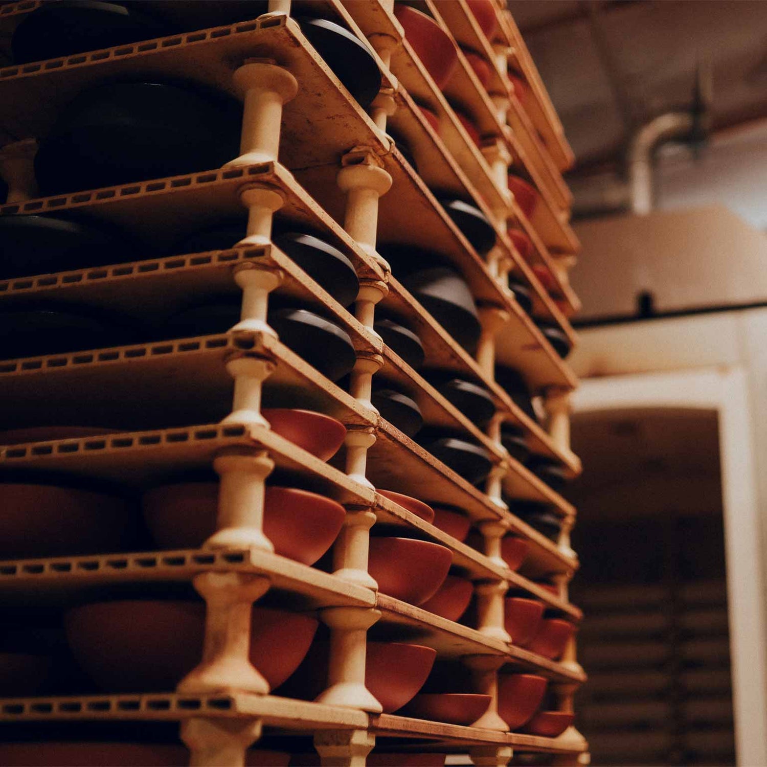 Neatly stacked clay pots and bowls before going into the oven
