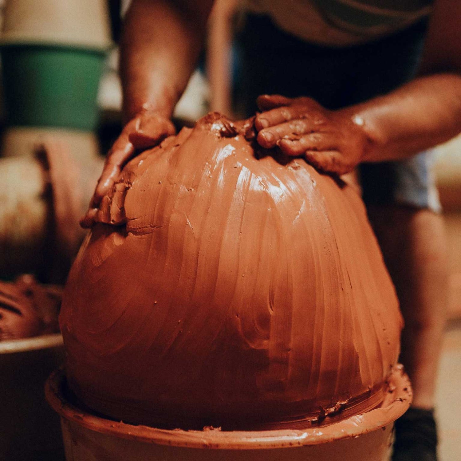 Shaping the clay into large spheres